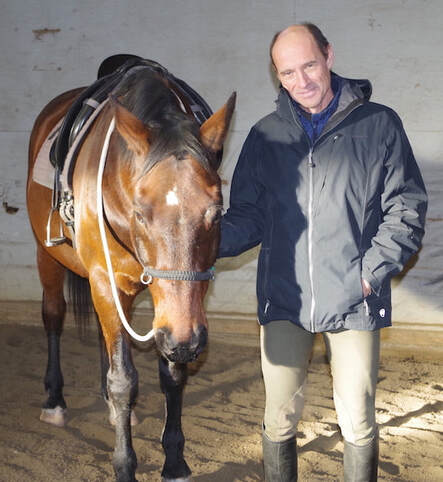 Thomas Kubli working with a horse at libery